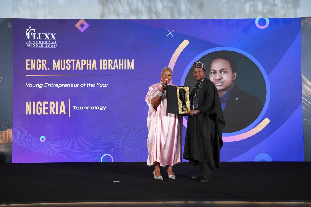 Mustapha Ibrahim receiving the Young Entrepreneur of the Year award at a Fluxx Conference ceremony